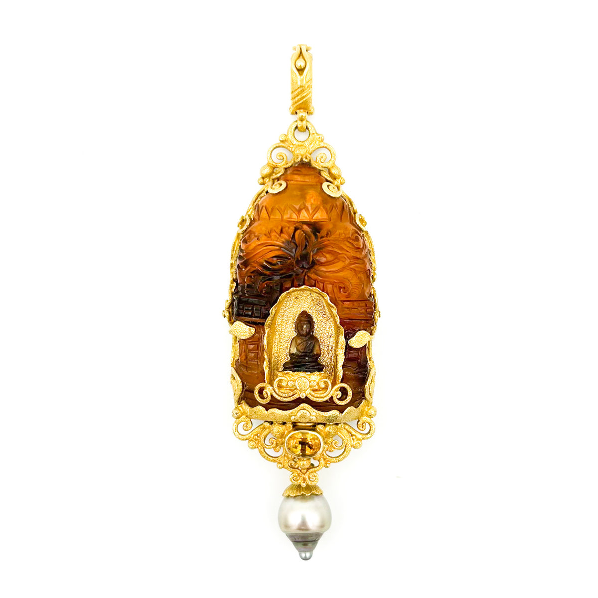 Gold and amber pendant with a central figure on a white background