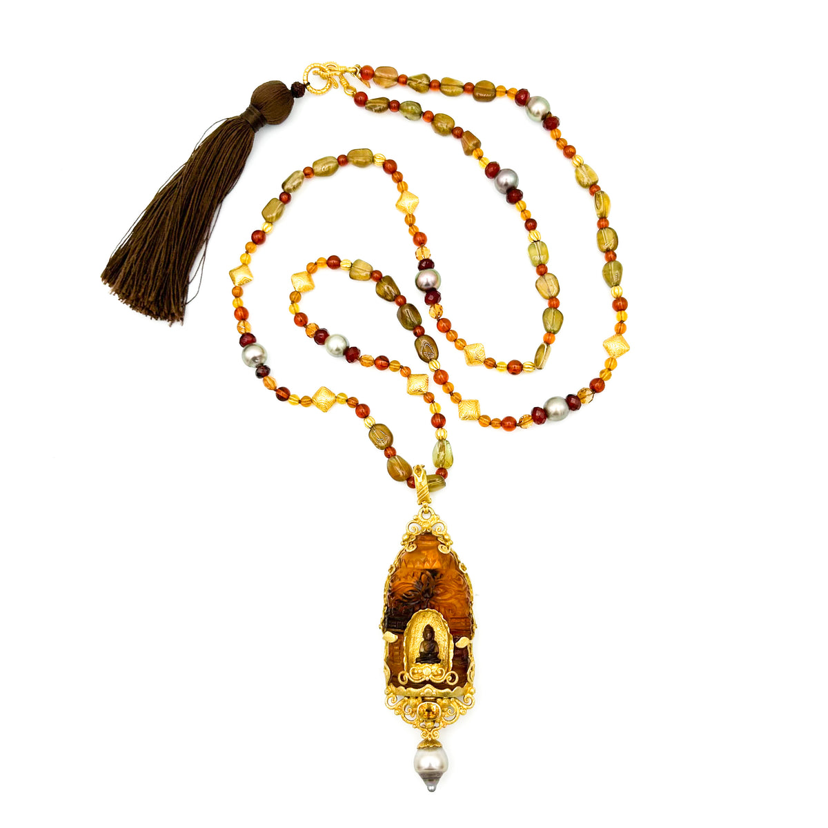 Necklace with beads and a pendant on a white background