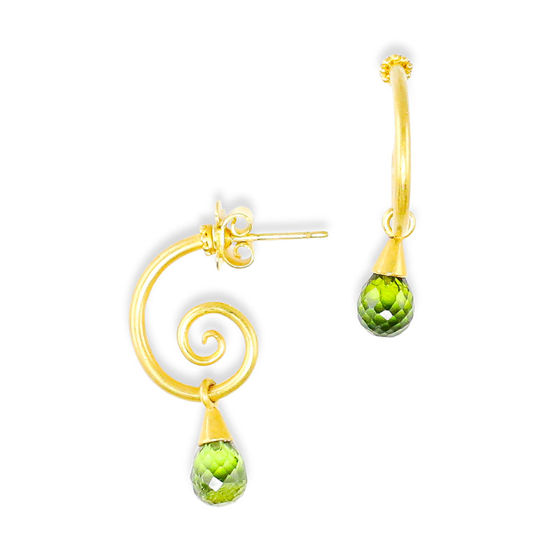 A pair of 'Curlique Drop' earrings with green tourmaline teardrop-shaped briolettes suspended from a gold spiral hoop, set against a white background.
