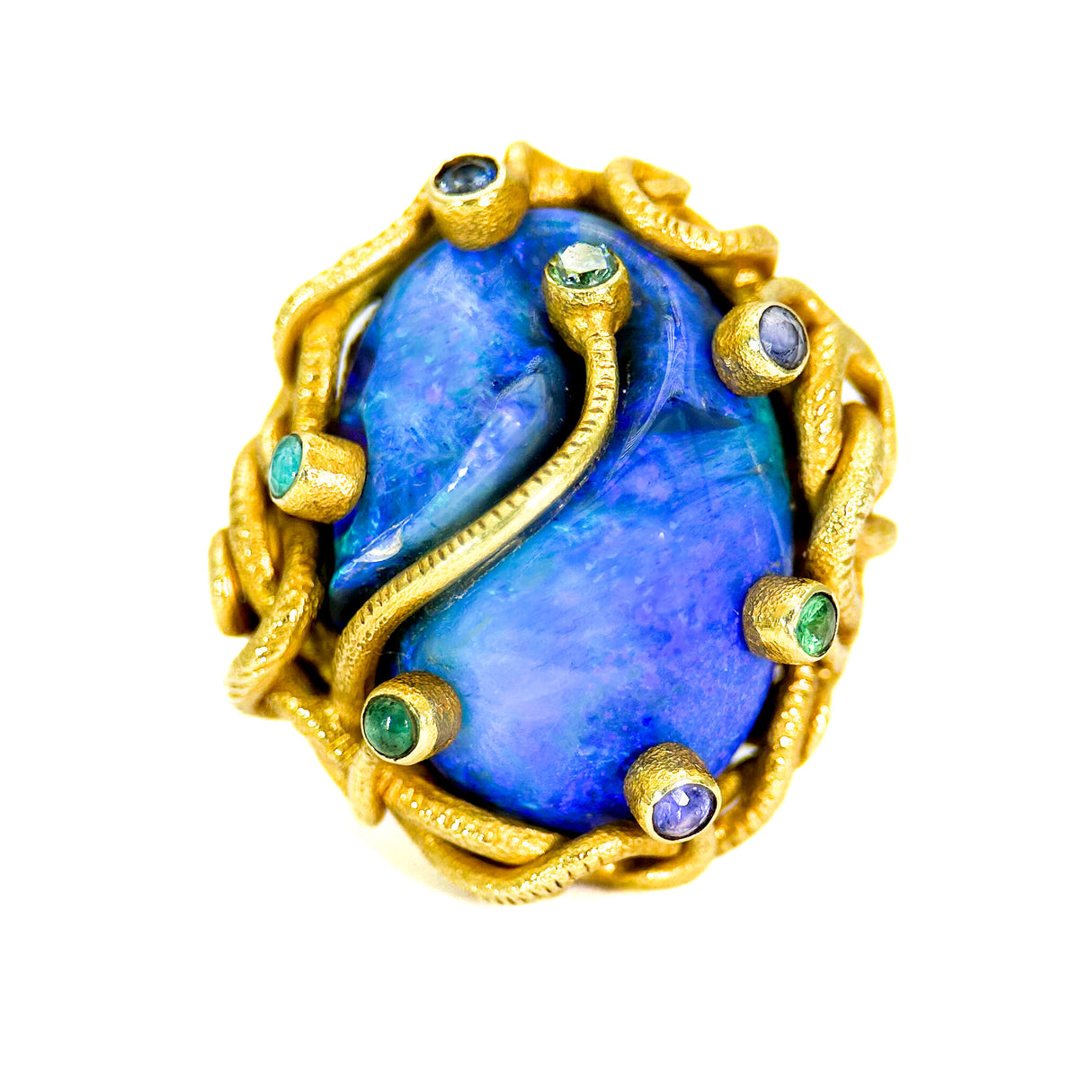 Ring with blue stone and gold frame on a white background
